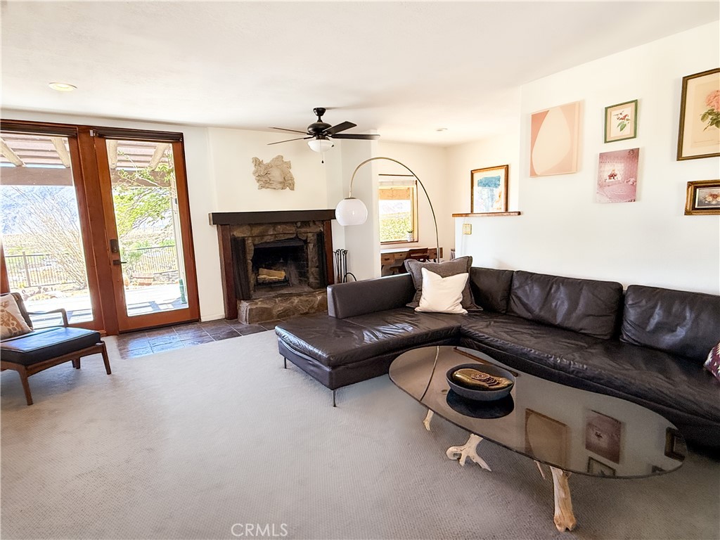 61612 Sagebrush Road North Palm Springs, CA 92258 - Photo 7 of 40 a living room with furniture and a fireplace