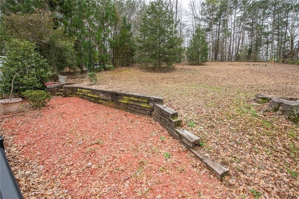 3819 Mason Creek Road Winston, GA 30187 - Photo 53 of 54 a view of a yard with trees