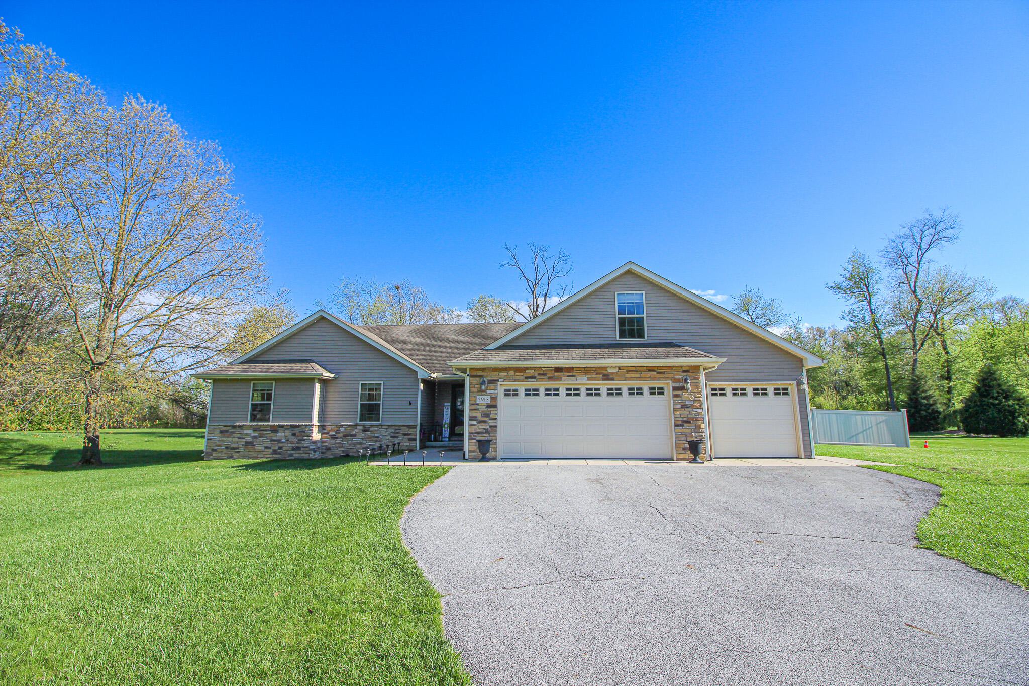 2913 Cardinal Drive Wheatfield, IN 46392 - Photo 26 of 34 a front view of a house with a yard