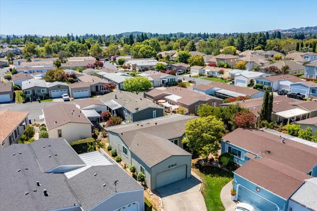 an aerial view of a house with a swimming pool
