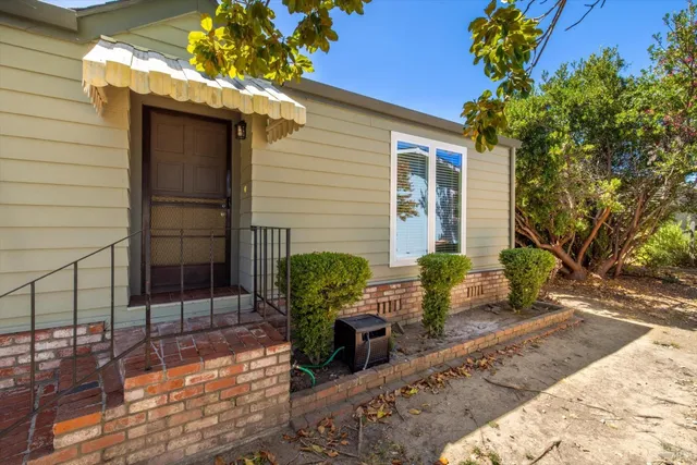 a view of a chairs and table in the patio