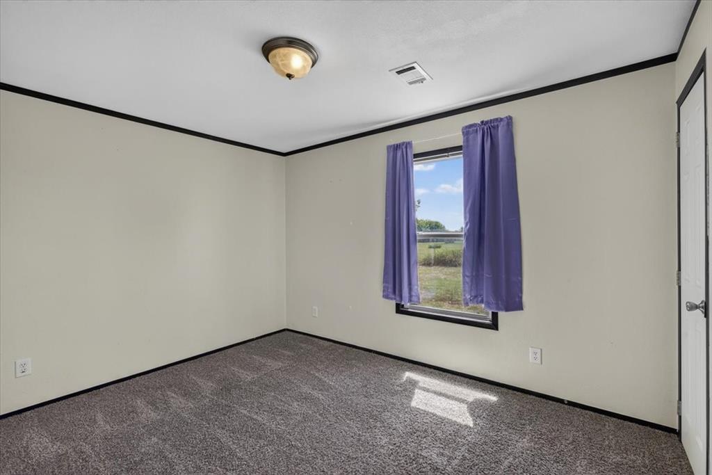 1129 Ragsdale Street Terrell, TX 75160 - Photo 13 of 29 Another secondary bedroom