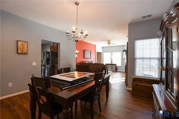 a kitchen that has a table and chairs in it