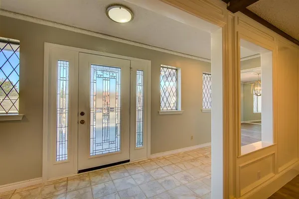 a view of a hallway with windows