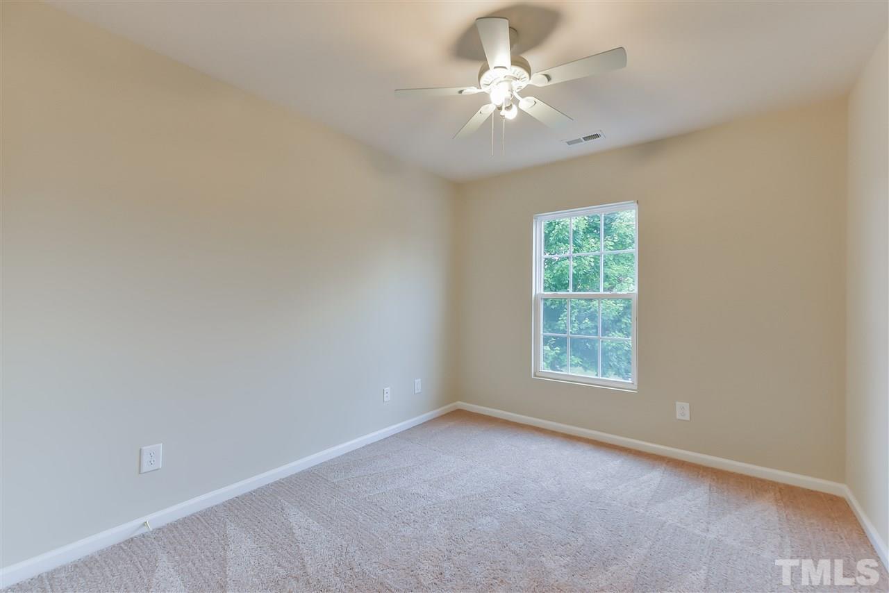 8133 Rhiannon Road Raleigh, NC 27613 - Photo 11 of 13 The extra bedrooms are light filled with generous closets. Laundry room is just a few feet away.