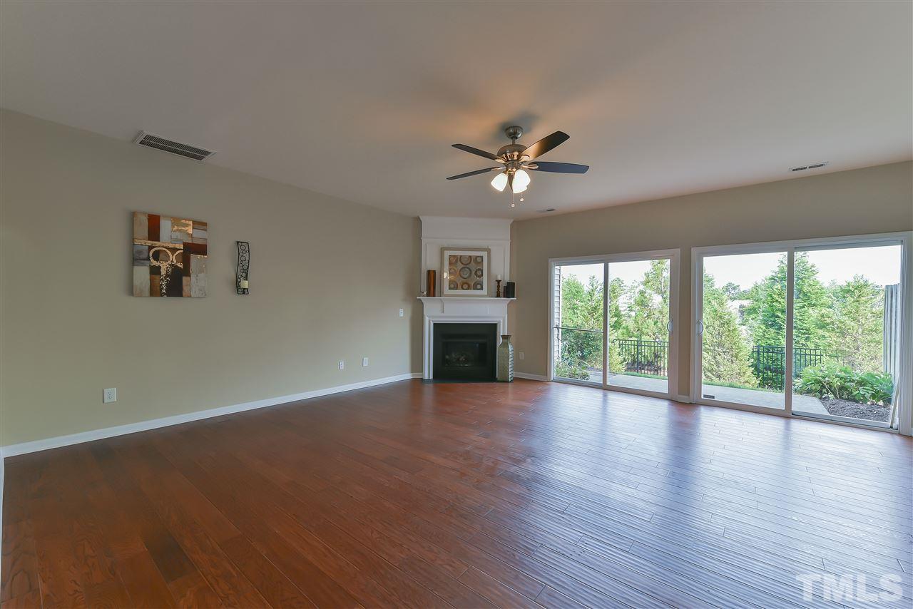 8133 Rhiannon Road Raleigh, NC 27613 - Photo 5 of 13 The fireplace will get you cozy on winter nights in the family room.