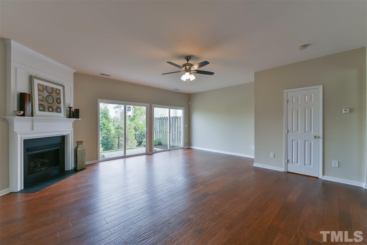 8133 Rhiannon Road Raleigh, NC 27613 - Photo 6 of 13 The den opens up to a private patio.