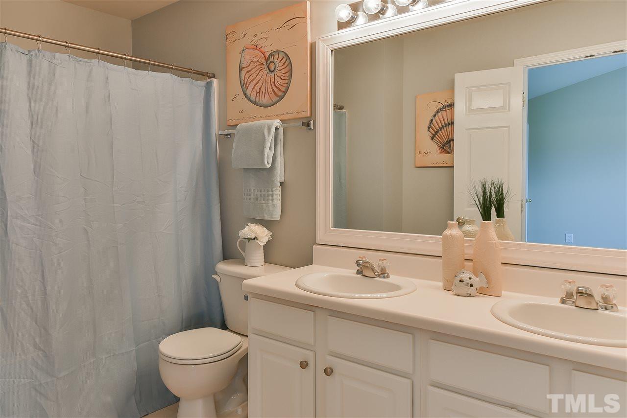 8133 Rhiannon Road Raleigh, NC 27613 - Photo 8 of 13 Dual sinks gives everyone their space on rushed mornings!