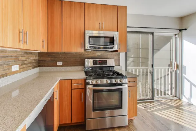 a kitchen with a stove and a microwave