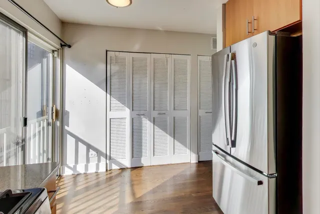 a view of entryway with wooden floor and stairs