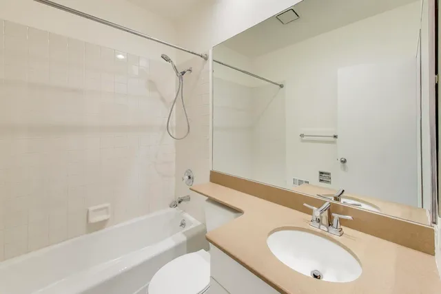 a bathroom with a sink toilet and a bathtub