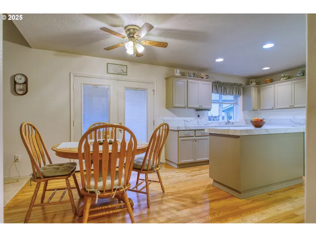 a kitchen with a sink a stove and cabinets