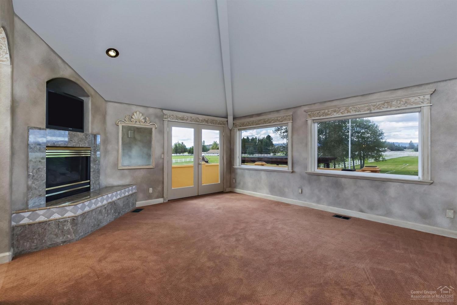 65131 Highland Road Bend, OR 97703 - Photo 12 of 22 a view of empty room with a fireplace