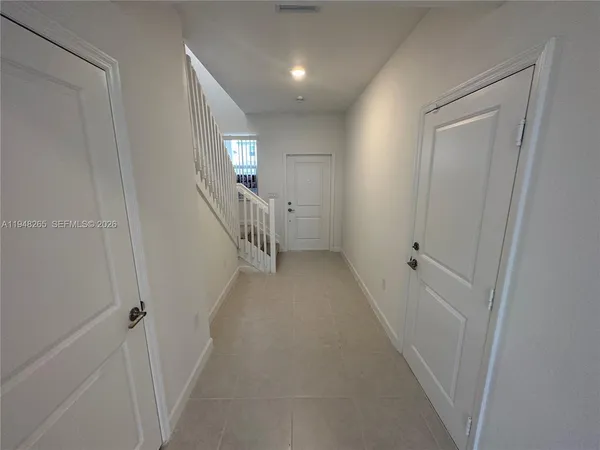 a view of hallway with stairs