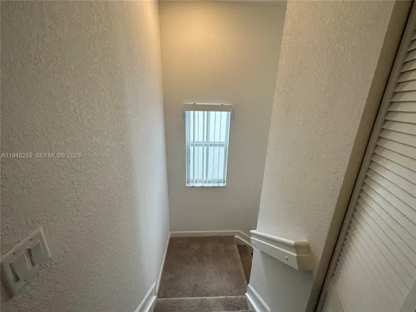 a view of room with window and hardwood