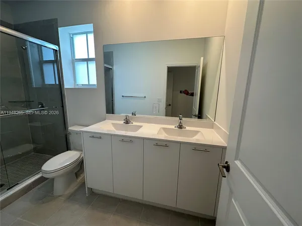 a bathroom with a sink and mirror