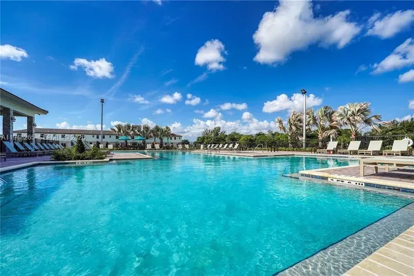 a view of a swimming pool with a table and chairs