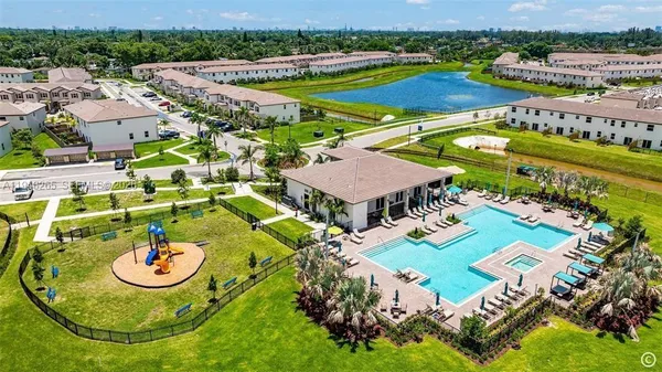 an aerial view of swimming pool patio and mountain view