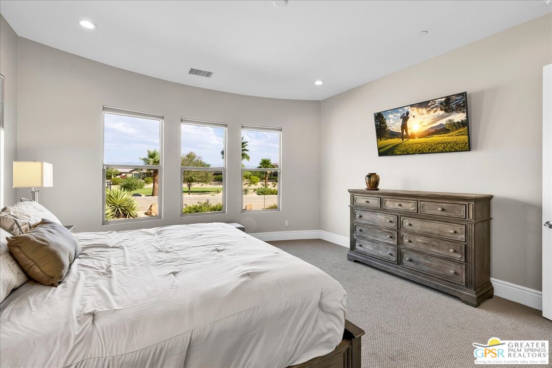 82 Cabernet Rancho Mirage, CA 92270 - Photo 11 of 25 a bedroom with a bed and a window
