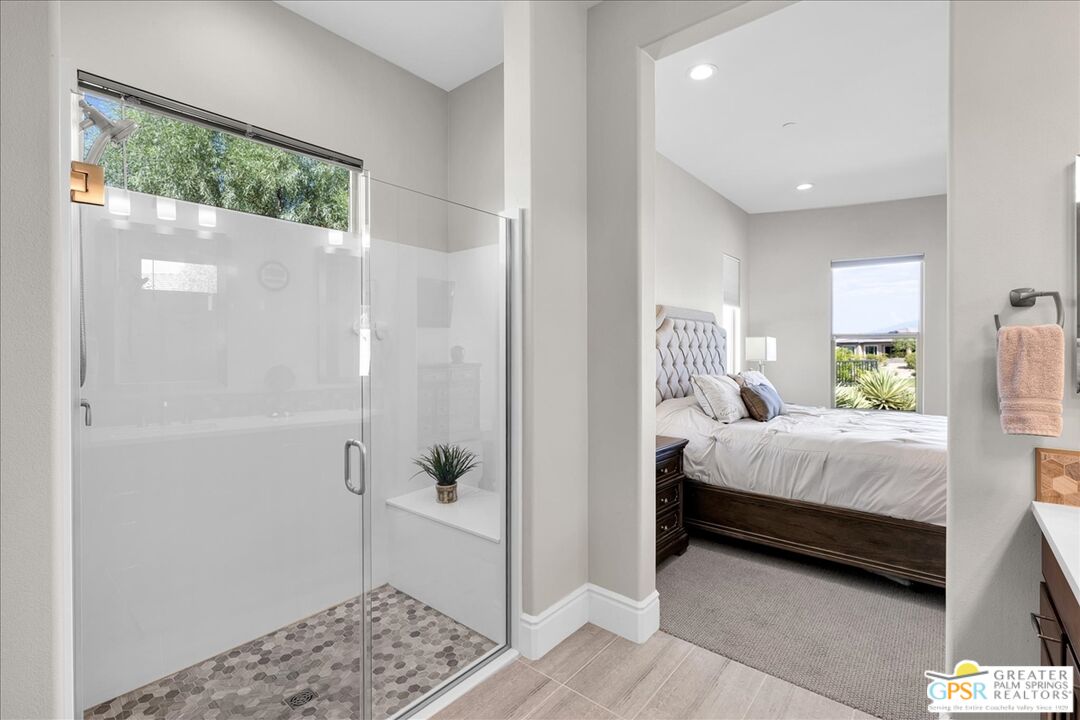 82 Cabernet Rancho Mirage, CA 92270 - Photo 12 of 25 a bedroom with a bed and a window