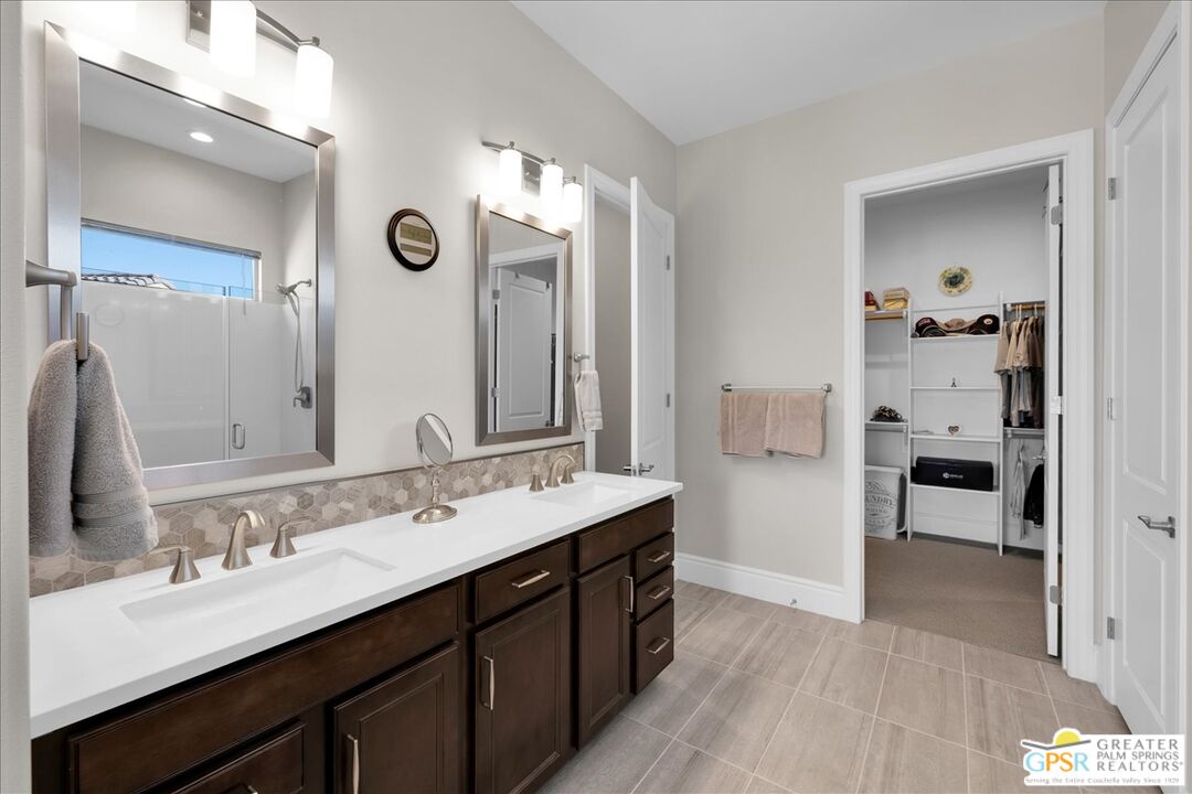 82 Cabernet Rancho Mirage, CA 92270 - Photo 13 of 25 a spacious bathroom with a double vanity sink a mirror and a shower