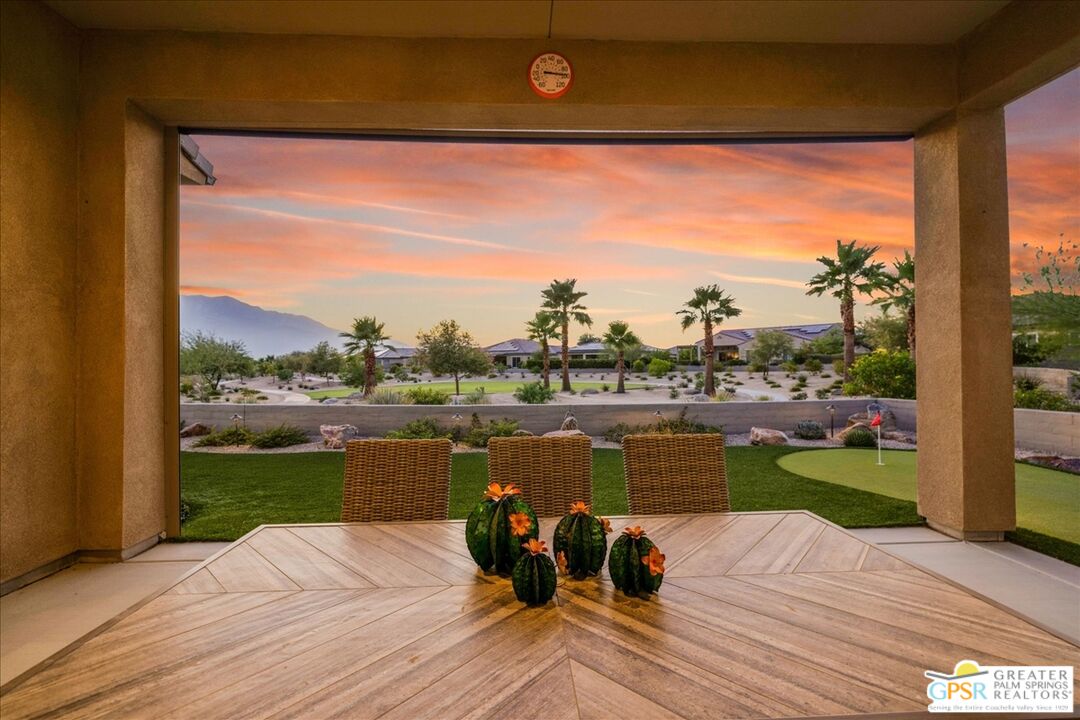 82 Cabernet Rancho Mirage, CA 92270 - Photo 20 of 25 a view of a lake with a floor to ceiling window next to a yard