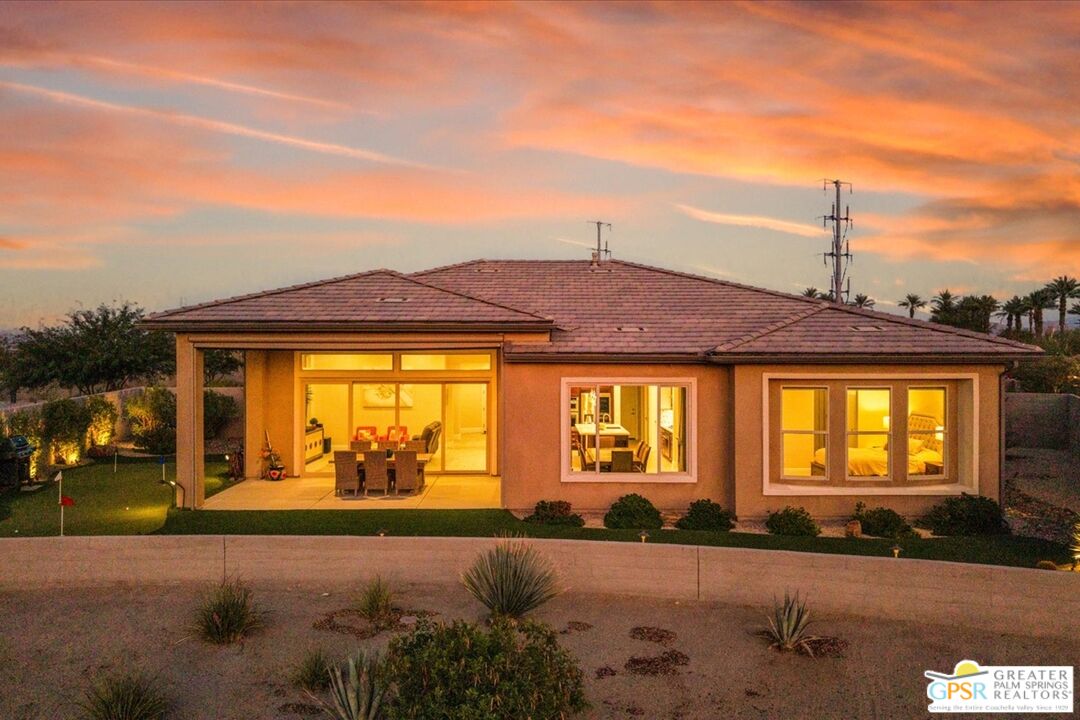 82 Cabernet Rancho Mirage, CA 92270 - Photo 21 of 25 a front view of a house with a yard