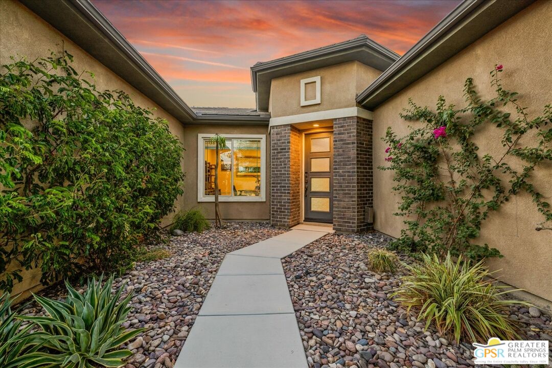 82 Cabernet Rancho Mirage, CA 92270 - Photo 22 of 25 a front view of a house with a yard