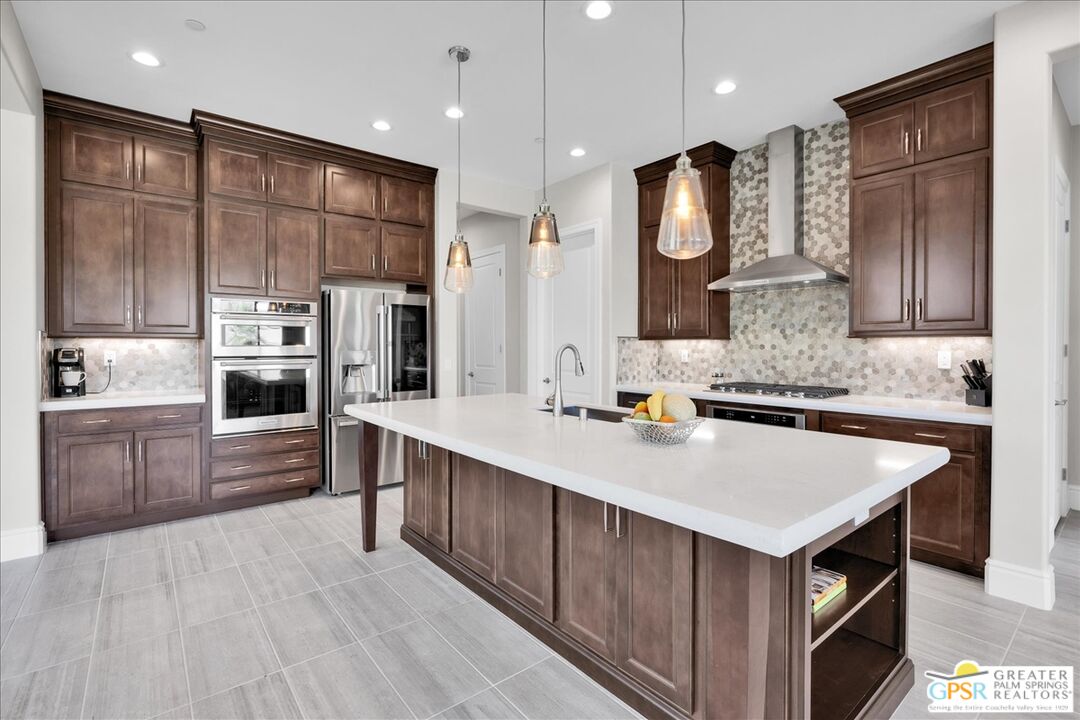 82 Cabernet Rancho Mirage, CA 92270 - Photo 8 of 25 a kitchen with cabinets and stainless steel appliances