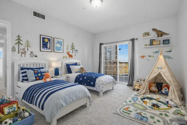 a view of an empty room and a window