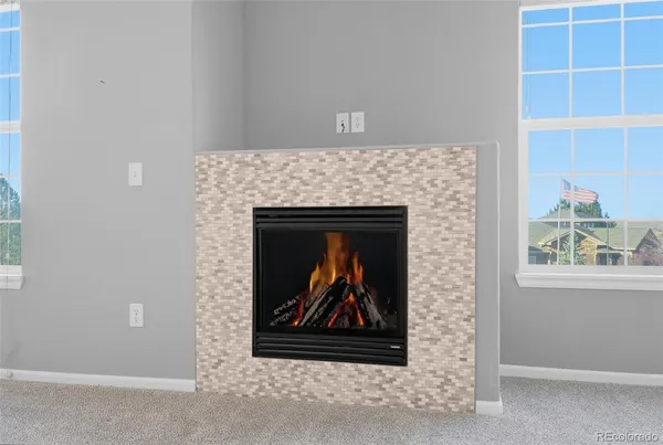 a stone house with a fireplace
