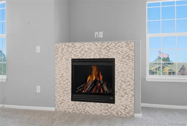 a stone house with a fireplace