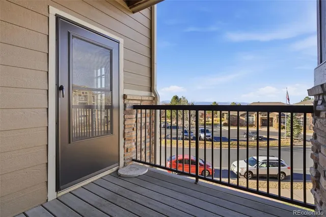 a view of a balcony with wooden floor