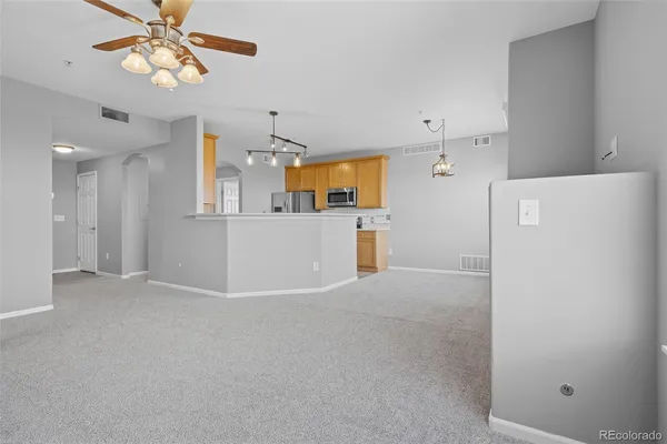 a view of a kitchen with a refrigerator a kitchen a refrigerator a sink and a refrigerator