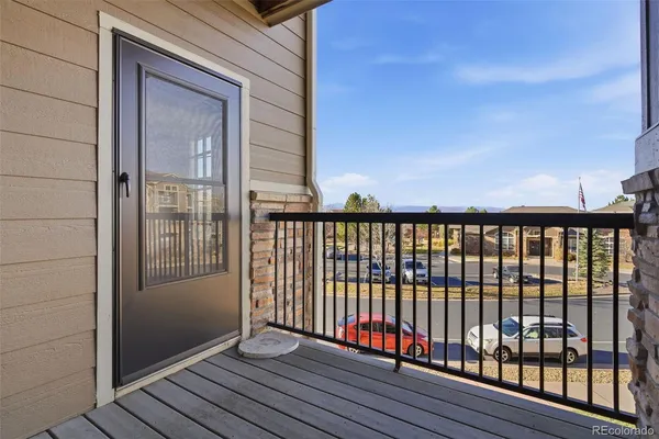 a view of a balcony with wooden floor