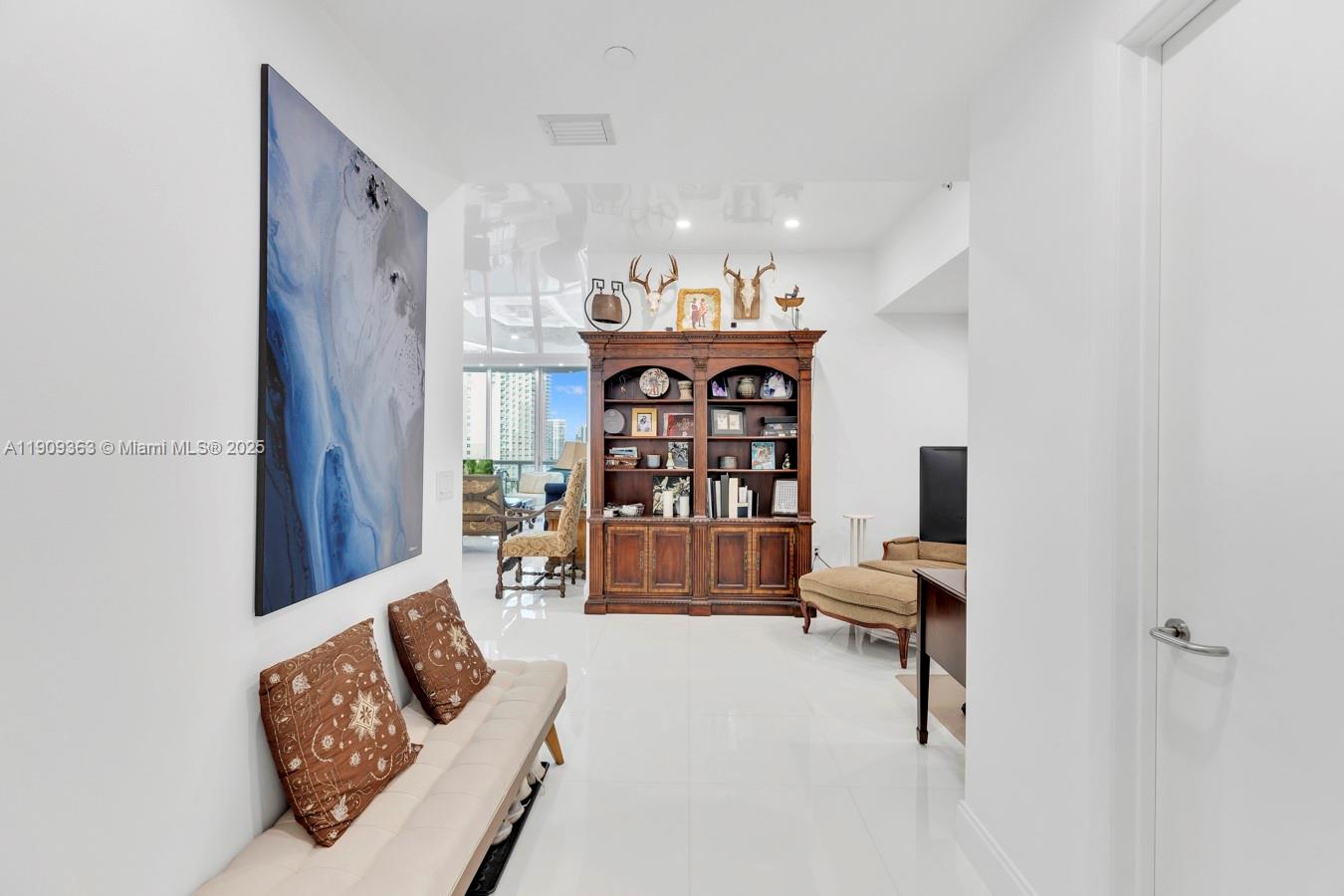 3131 Northeast 188th Street, Unit 21004 Aventura, FL 33180 - Photo 15 of 53 a living room with furniture and a couch