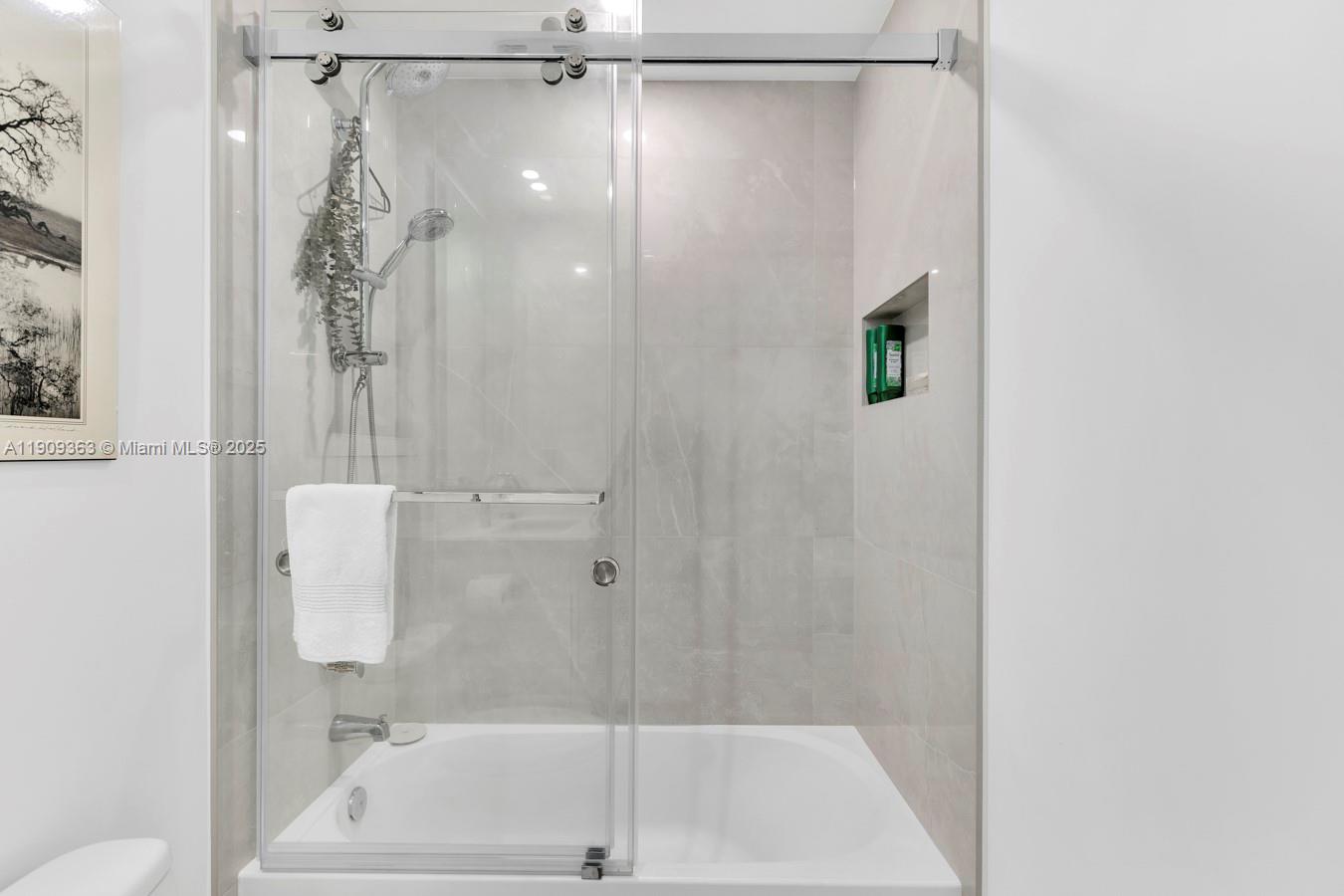 3131 Northeast 188th Street, Unit 21004 Aventura, FL 33180 - Photo 19 of 53 a bathroom with a shower