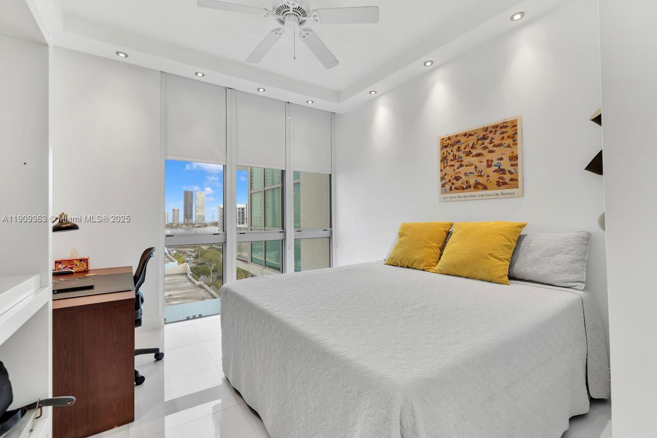 3131 Northeast 188th Street, Unit 21004 Aventura, FL 33180 - Photo 20 of 53 a bedroom with a bed couch and a window