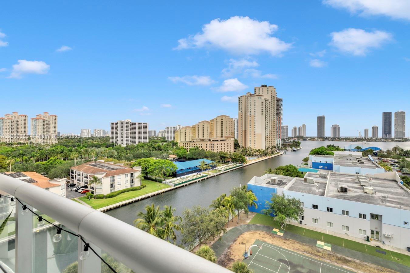 3131 Northeast 188th Street, Unit 21004 Aventura, FL 33180 - Photo 2 of 53 a city view from a balcony with outdoor seating