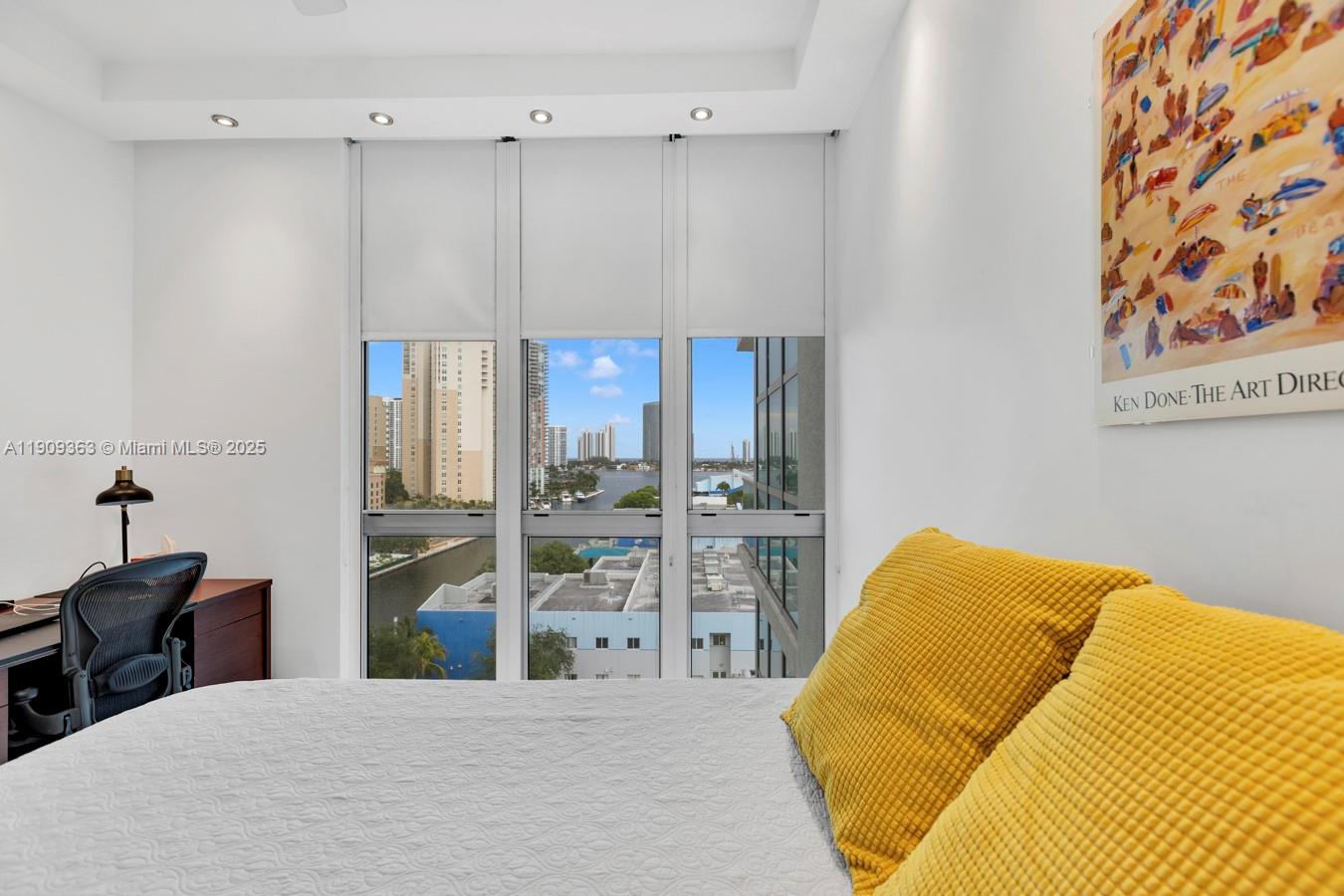 3131 Northeast 188th Street, Unit 21004 Aventura, FL 33180 - Photo 21 of 53 a bedroom with a bed and a lamp