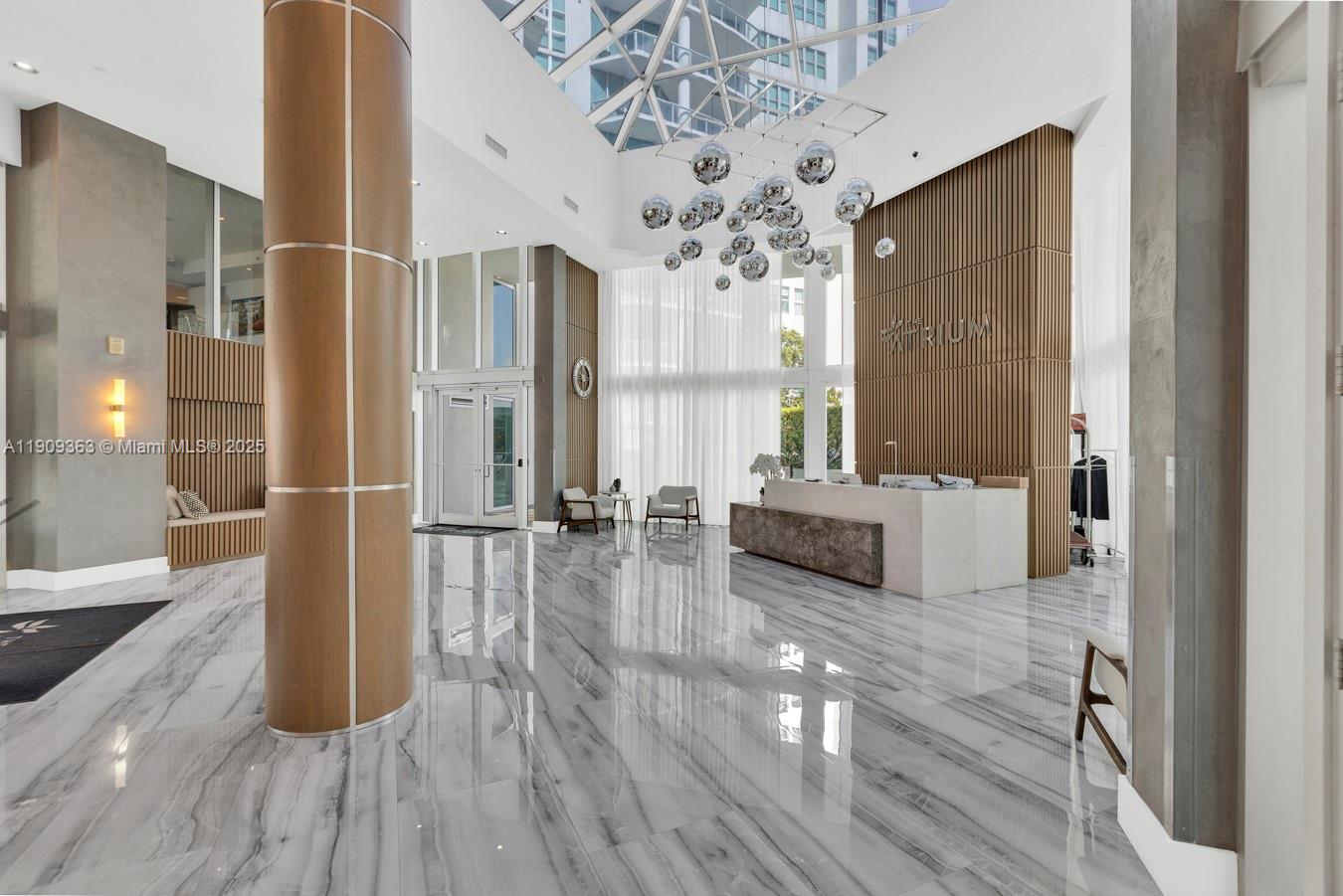 3131 Northeast 188th Street, Unit 21004 Aventura, FL 33180 - Photo 38 of 53 a spacious bathroom with a tub shower and windows
