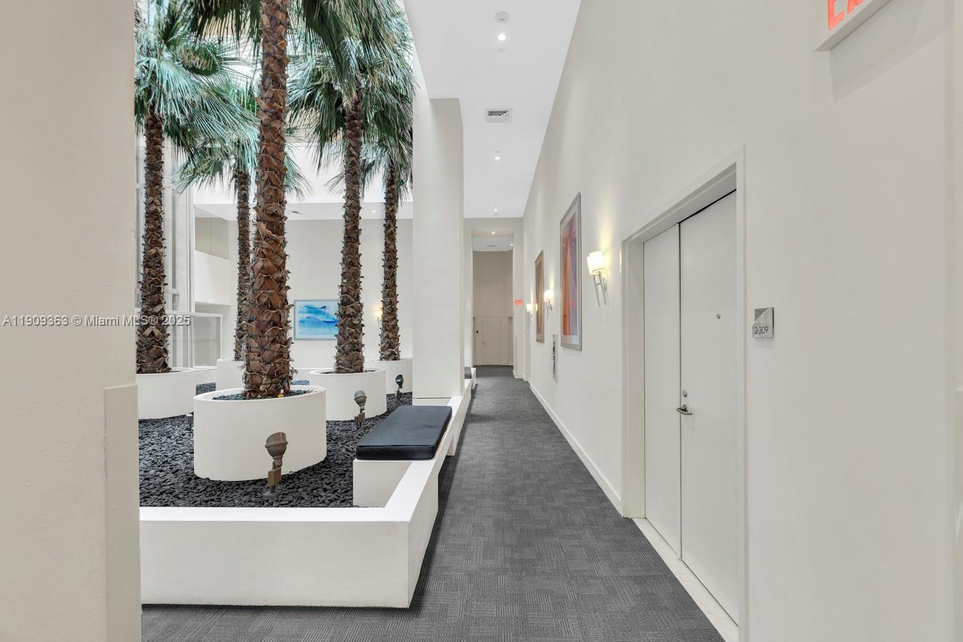3131 Northeast 188th Street, Unit 21004 Aventura, FL 33180 - Photo 40 of 53 a living room with furniture and a potted plant