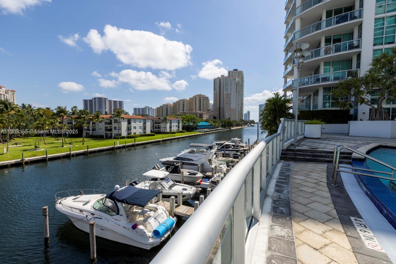 3131 Northeast 188th Street, Unit 21004 Aventura, FL 33180 - Photo 45 of 53 a view of a lake with tall building