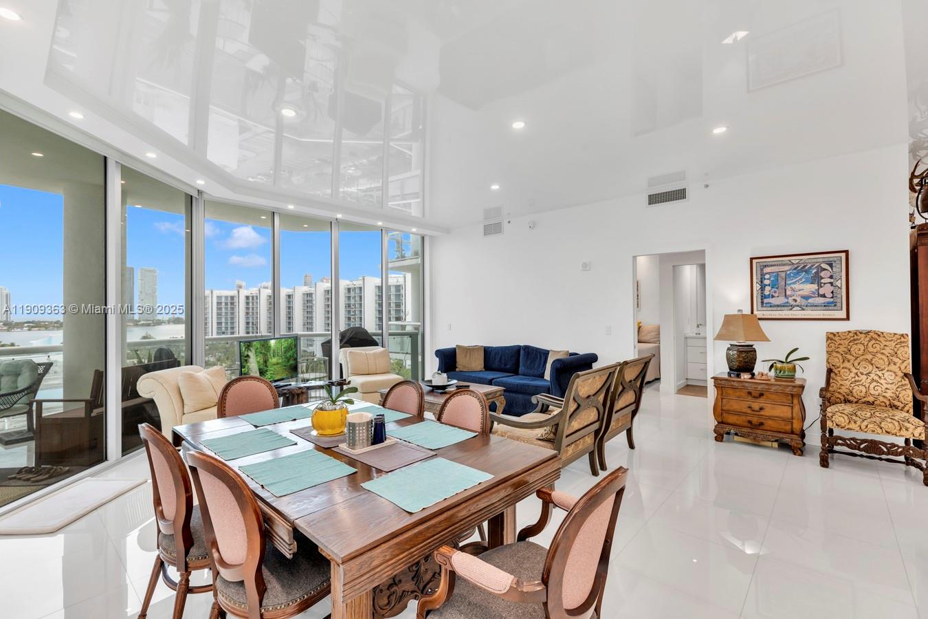 3131 Northeast 188th Street, Unit 21004 Aventura, FL 33180 - Photo 7 of 53 a dining room with furniture a table and chairs