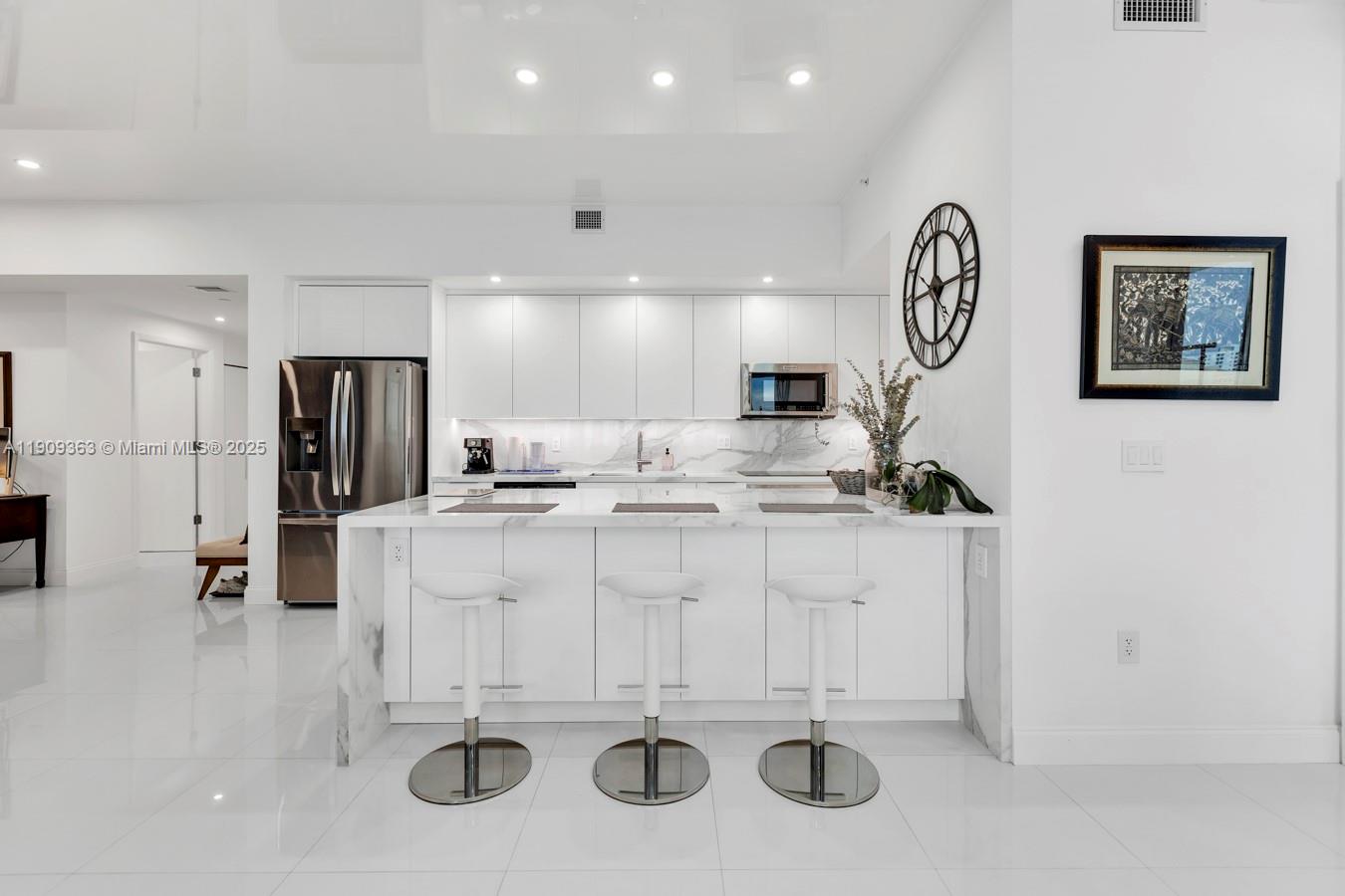 3131 Northeast 188th Street, Unit 21004 Aventura, FL 33180 - Photo 10 of 53 a bathroom with a sink and a mirror