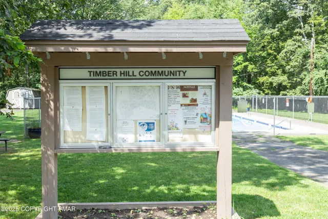 a front view of a house with a yard table and chairs