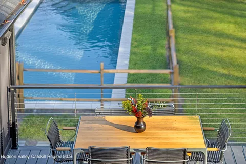 a spacious bedroom with a bed and a fireplace