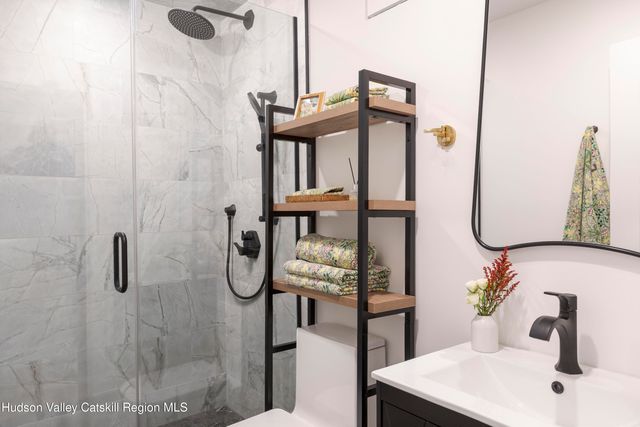 a bathroom with a double vanity sink and mirror