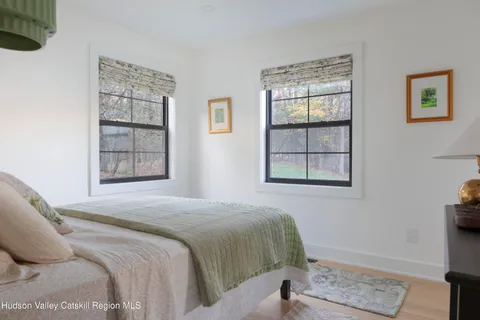 a bath tub sitting in a bathroom next to a window