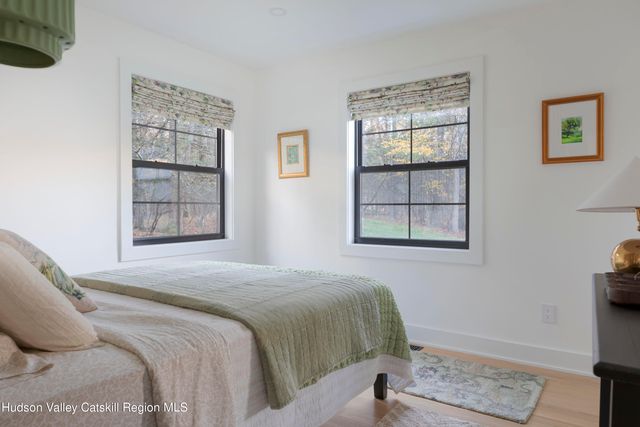 a bath tub sitting in a bathroom next to a window